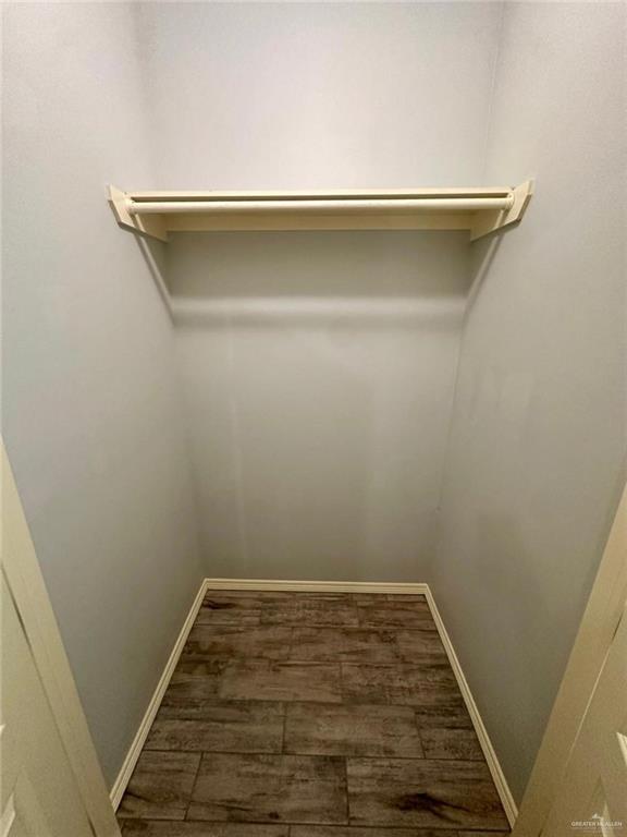 1503 West Heritage Drive, Unit 1 Pharr, TX 78577 - Photo 12 of 17 Walk in closet featuring dark wood-style floors