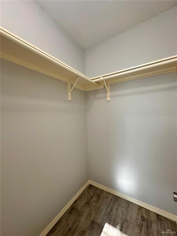 1503 West Heritage Drive, Unit 1 Pharr, TX 78577 - Photo 15 of 17 Spacious closet with dark wood-style floors