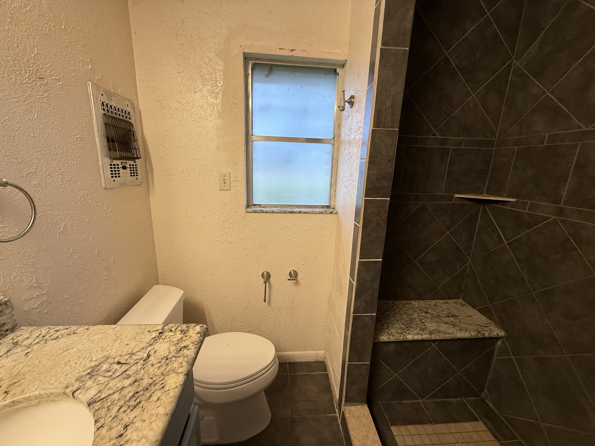 13907 Mueck Road Needville, TX 77461 - Photo 13 of 27 a bathroom with a toilet and a shower