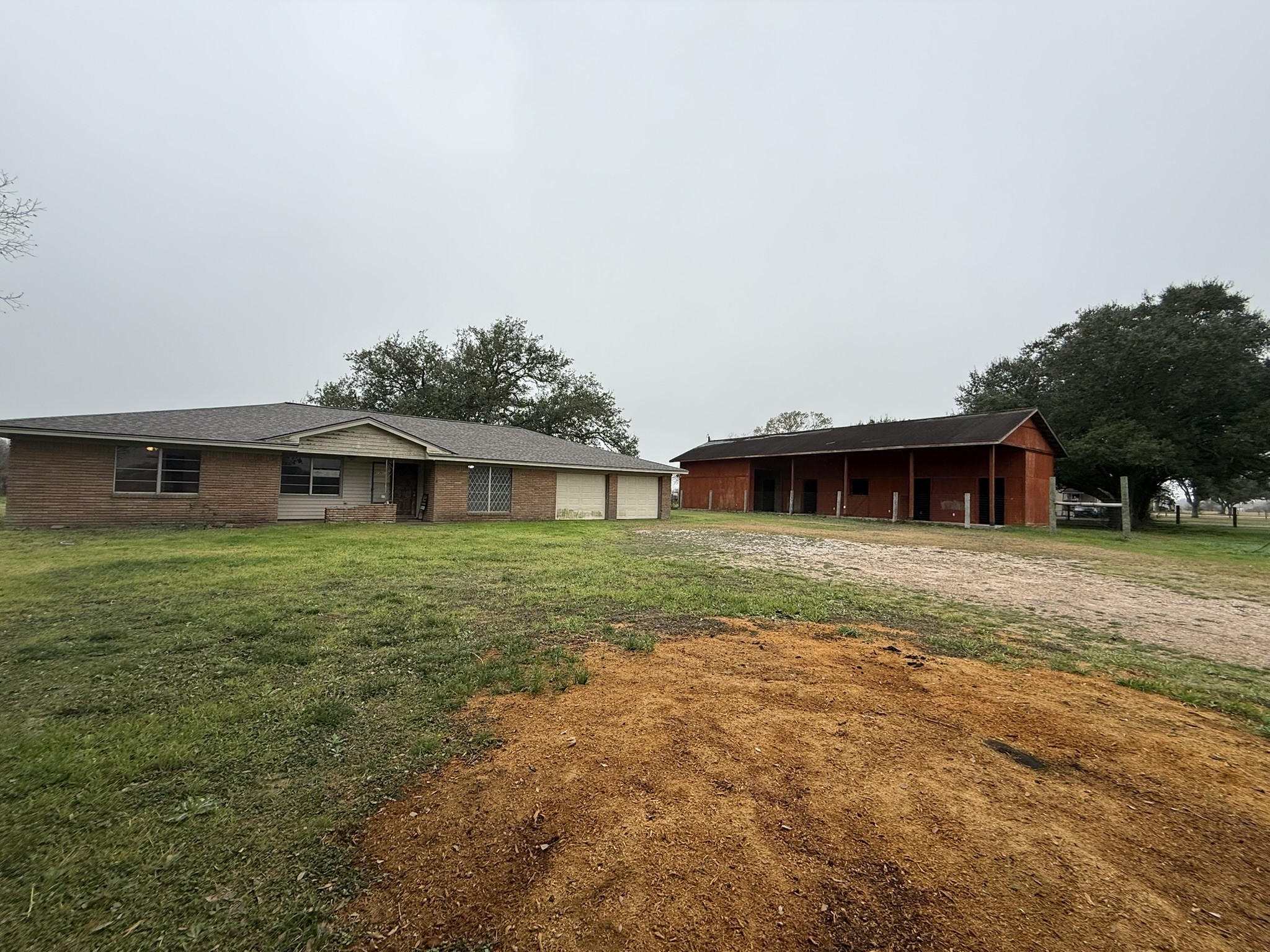 13907 Mueck Road Needville, TX 77461 - Photo 2 of 27 a front view of a house with a yard