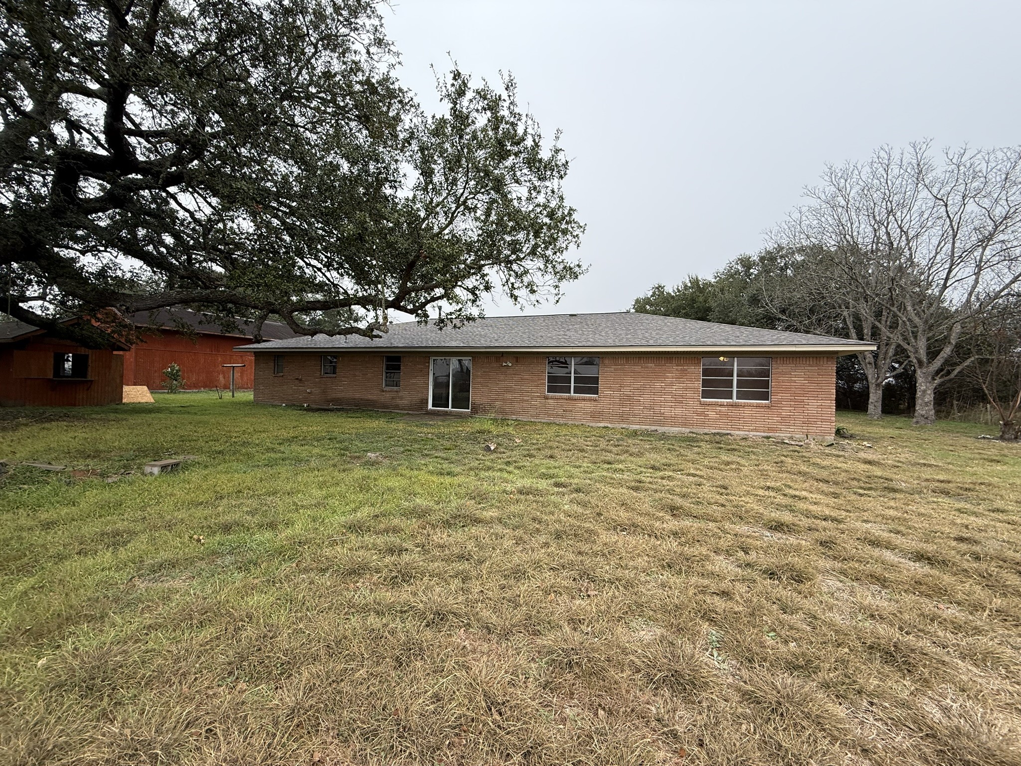 13907 Mueck Road Needville, TX 77461 - Photo 27 of 27 a front view of house with yard and trees in the background