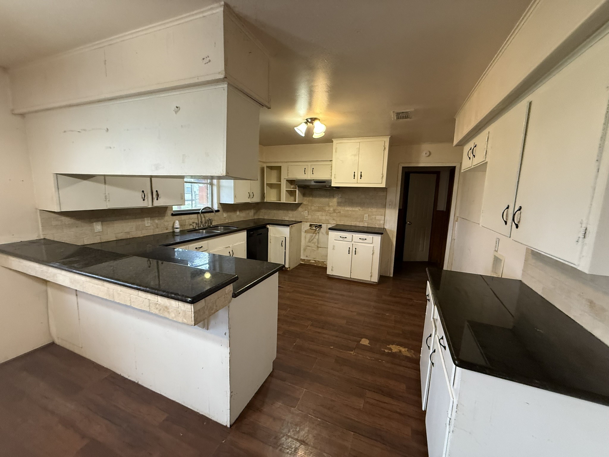 13907 Mueck Road Needville, TX 77461 - Photo 4 of 27 a kitchen with stainless steel appliances granite countertop a sink and a stove