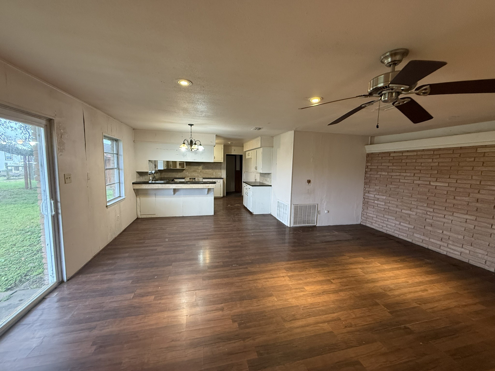 13907 Mueck Road Needville, TX 77461 - Photo 5 of 27 a view of a kitchen with a sink and a stove top oven