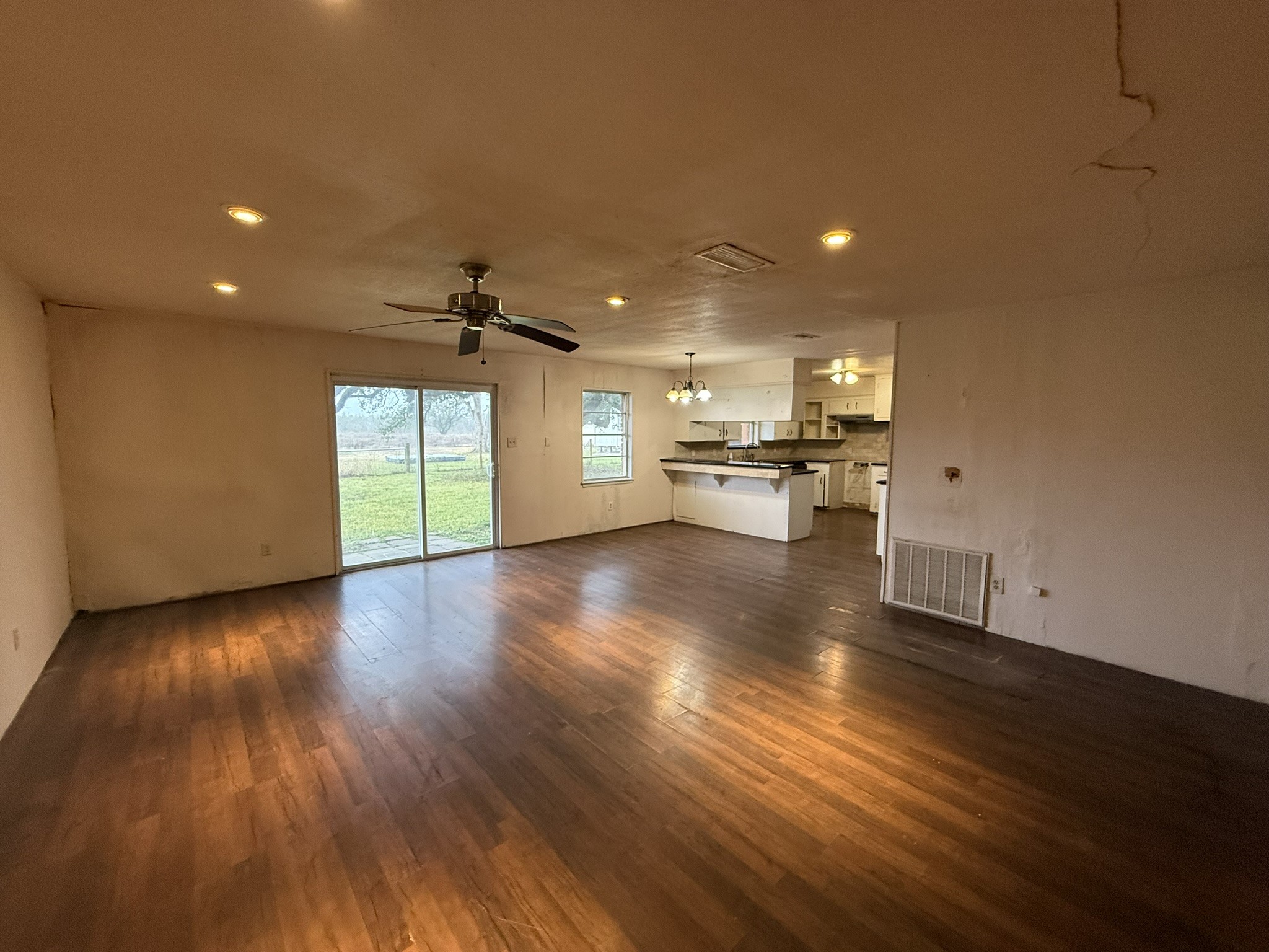 13907 Mueck Road Needville, TX 77461 - Photo 8 of 27 a view of a kitchen with a sink and a stove top oven