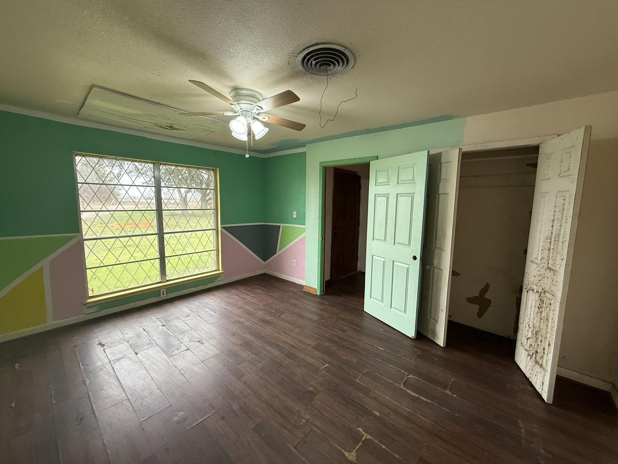 13907 Mueck Road Needville, TX 77461 - Photo 10 of 27 wooden floor in an empty room with a window