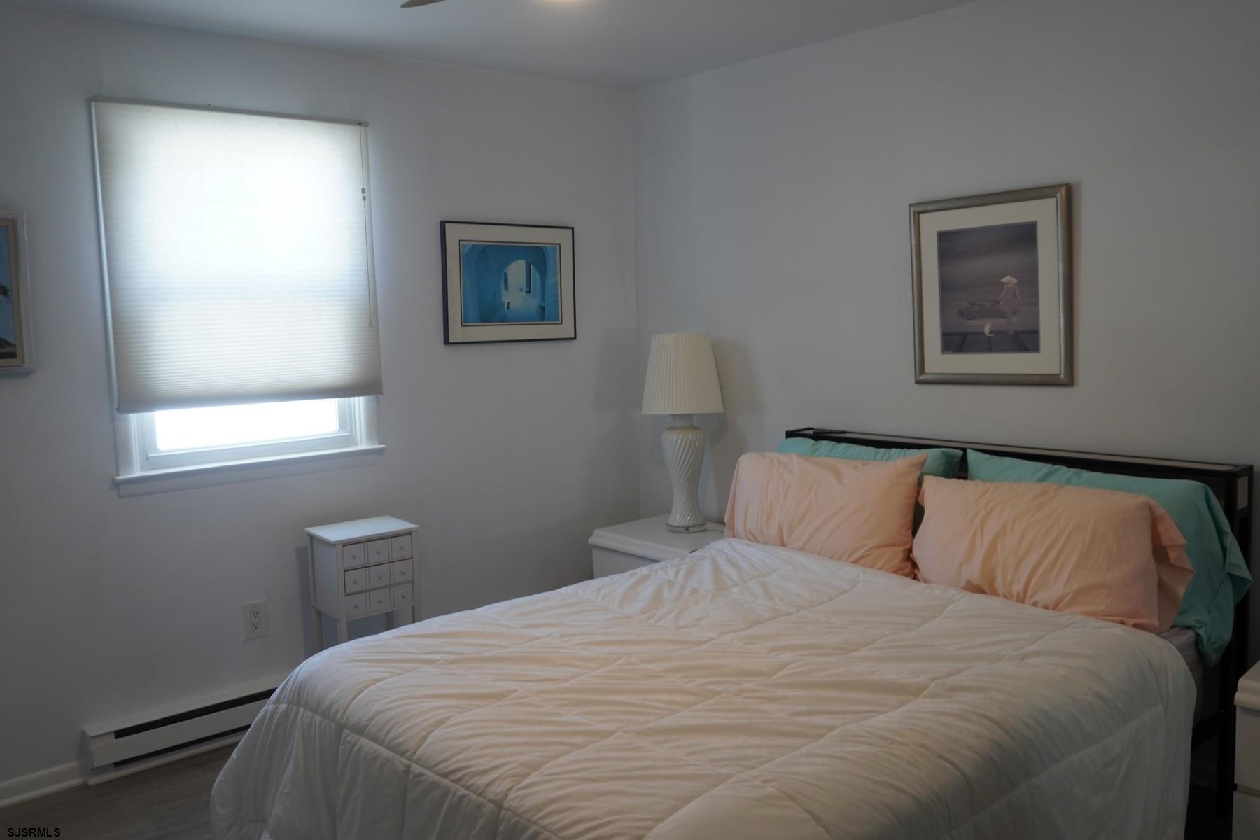 15 South Decatur Avenue, Unit B Margate City, NJ 08402 - Photo 18 of 27 a bedroom with a bed and a window