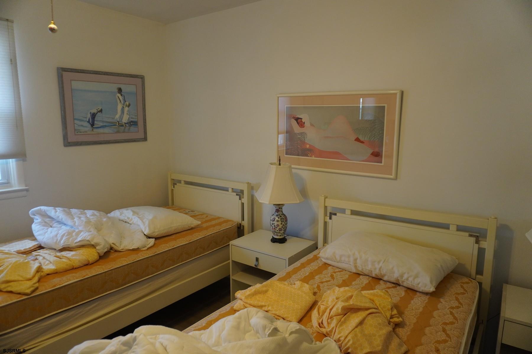 15 South Decatur Avenue, Unit B Margate City, NJ 08402 - Photo 25 of 27 a bedroom with a bed and the view of bathroom