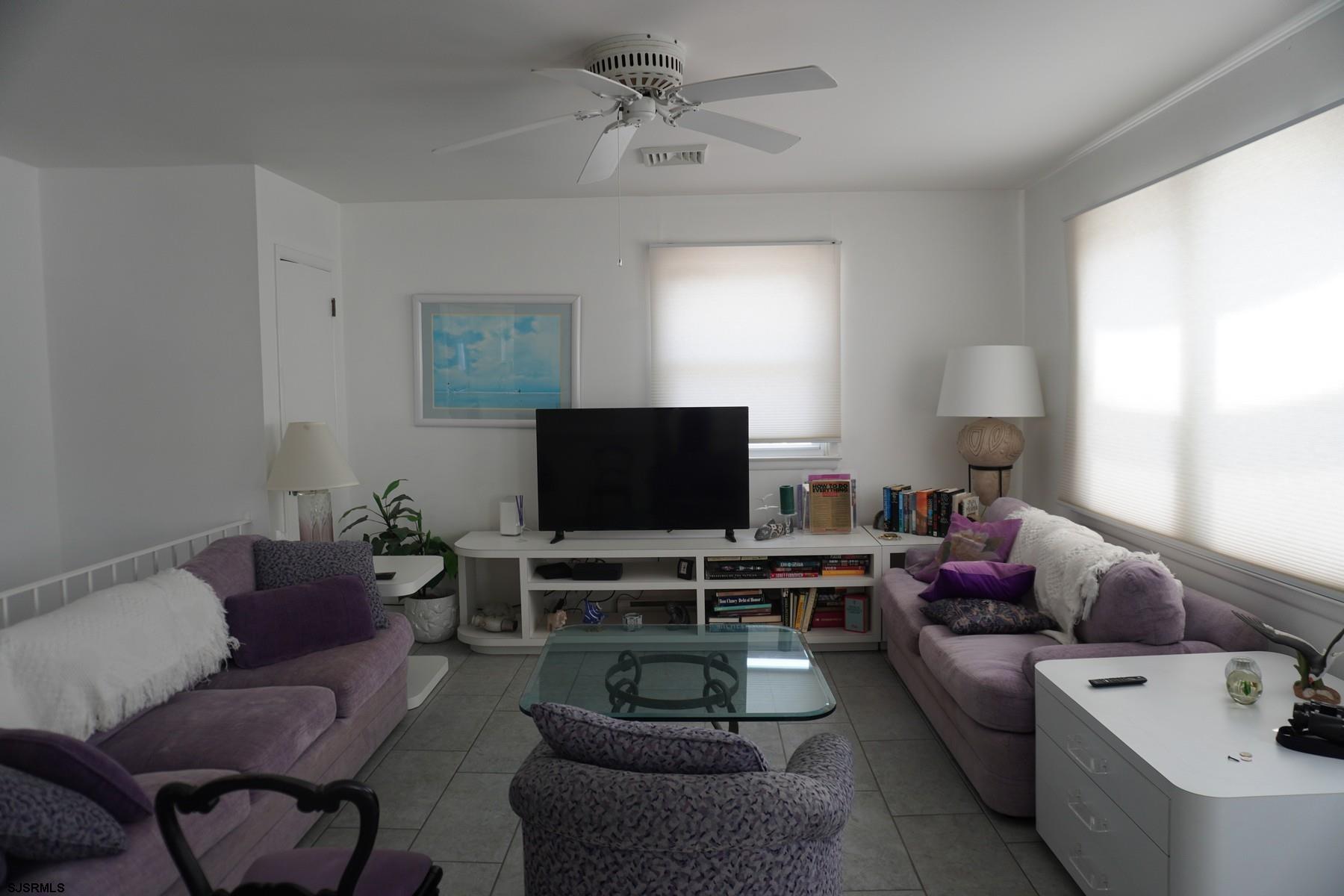 15 South Decatur Avenue, Unit B Margate City, NJ 08402 - Photo 9 of 27 a living room with furniture and a flat screen tv
