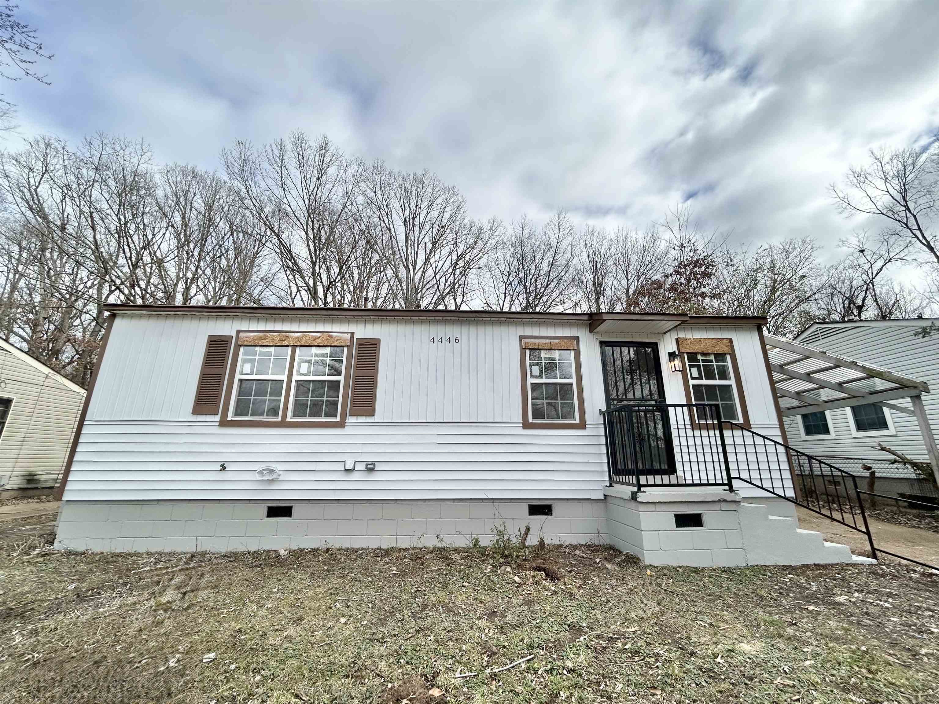 a front view of a house with a yard
