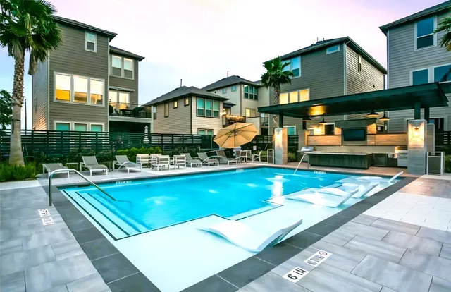 a view of kitchen with a sink and a microwave