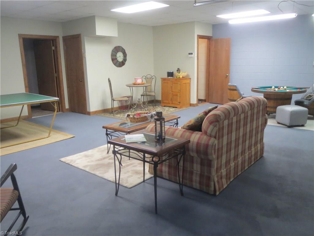953 Hodges Mill Road Dobson, NC 27017 - Photo 22 of 29 Spacious basement serving as multi-purpose family/game room.