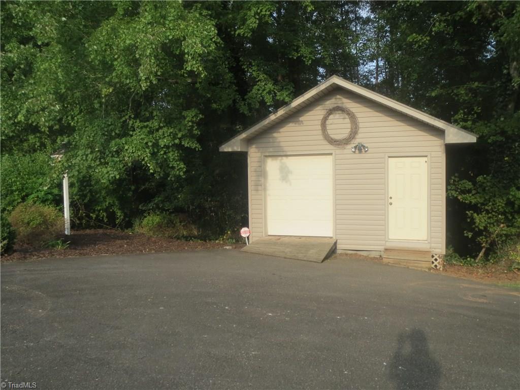 953 Hodges Mill Road Dobson, NC 27017 - Photo 29 of 29 Outbuilding serves as storage shed and workshop.