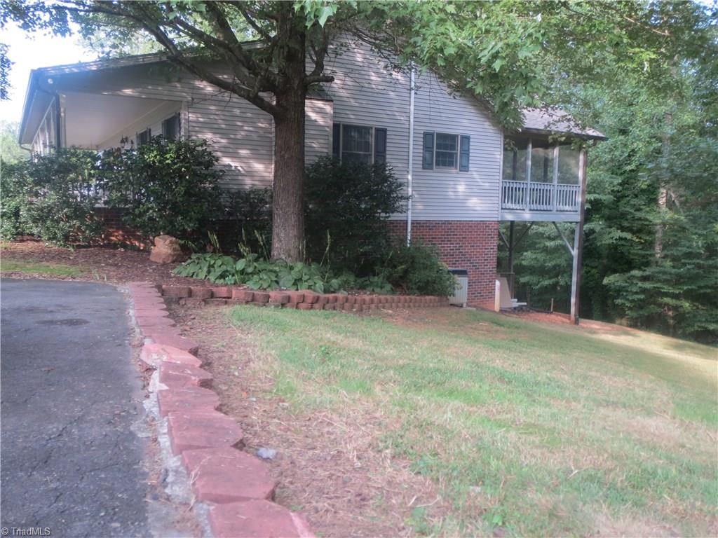 953 Hodges Mill Road Dobson, NC 27017 - Photo 5 of 29 View of side yard and screened back porch.