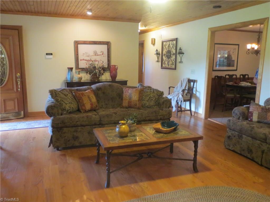 953 Hodges Mill Road Dobson, NC 27017 - Photo 10 of 29 View from living room looking toward front door, hallway and into kitchen.