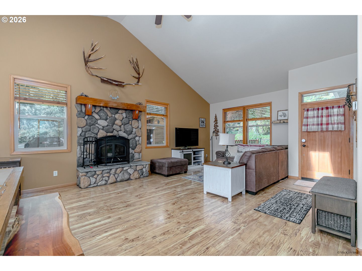 64636 Mc Intyre Road Rhododendron, OR 97049 - Photo 7 of 48 a living room with furniture a window and a fireplace