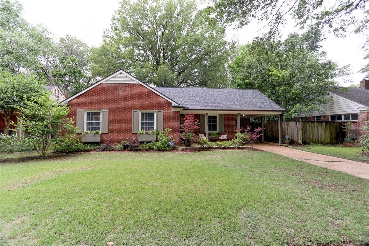 1611 Ivy Road Memphis, TN 38117 - Photo 1 of 29 a front view of a house with yard and porch