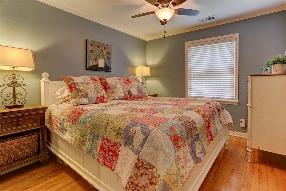 1611 Ivy Road Memphis, TN 38117 - Photo 18 of 29 a large bed sitting in a bedroom next to a lamp