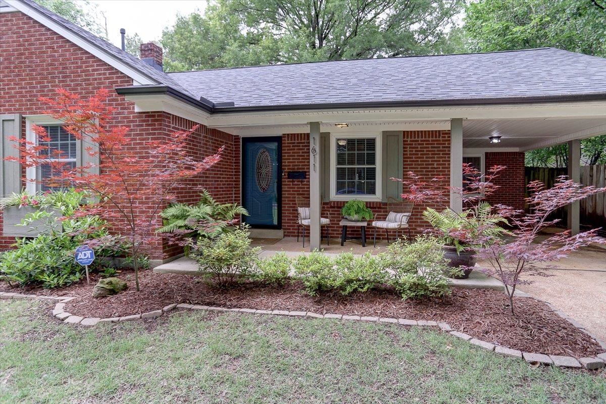 1611 Ivy Road Memphis, TN 38117 - Photo 2 of 29 a view of a house with sitting area and garden