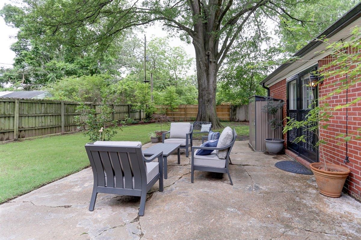 1611 Ivy Road Memphis, TN 38117 - Photo 28 of 29 a view of a chair and fire pit in the backyard