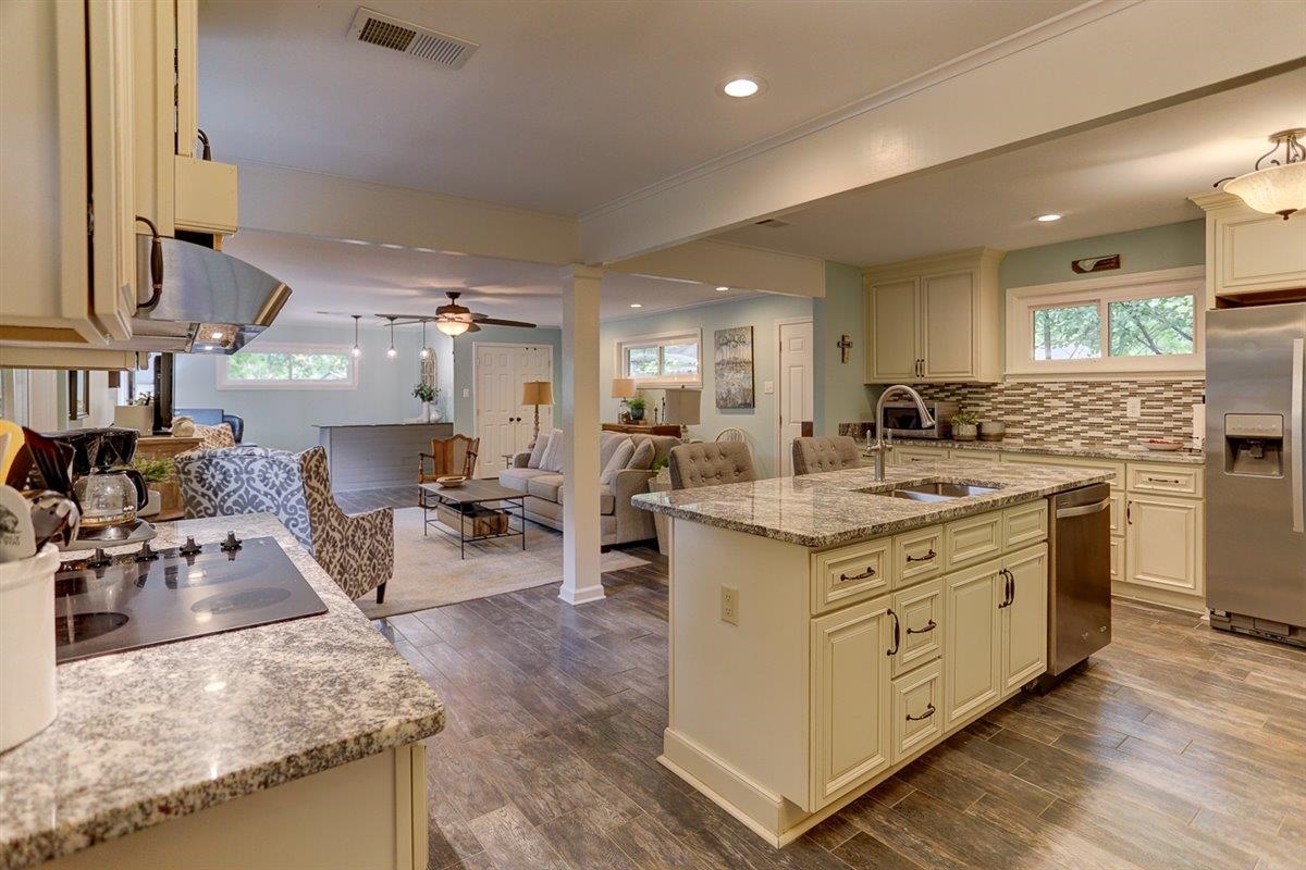 1611 Ivy Road Memphis, TN 38117 - Photo 7 of 29 a kitchen with stainless steel appliances granite countertop a stove oven and a refrigerator