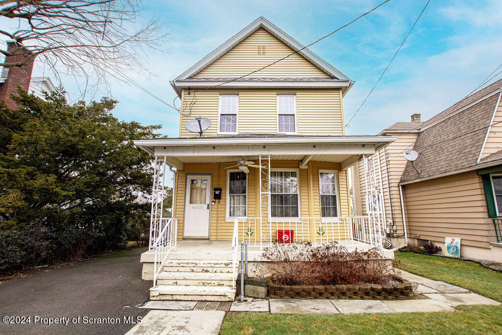 1148 West Locust Street Scranton, PA 18504 - Photo 1 of 40 a front view of a house with a yard