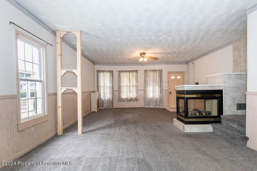 1148 West Locust Street Scranton, PA 18504 - Photo 13 of 40 a view of livingroom with furniture and fireplace