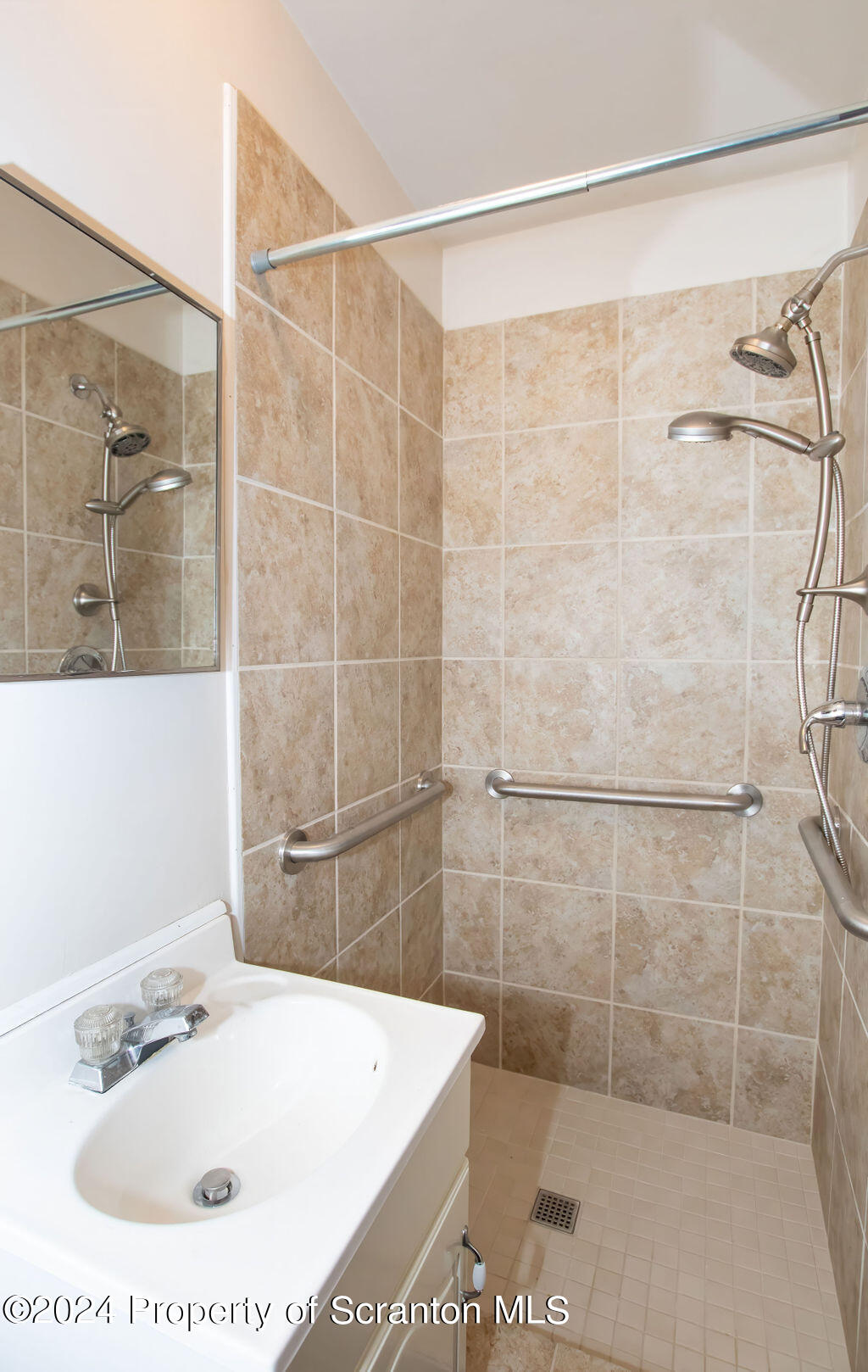 1148 West Locust Street Scranton, PA 18504 - Photo 16 of 40 a bathroom with a sink and shower