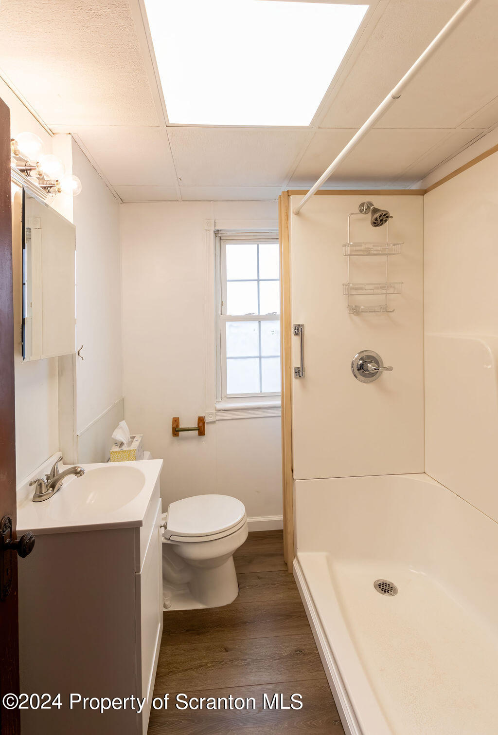 1148 West Locust Street Scranton, PA 18504 - Photo 20 of 40 a bathroom with a sink a toilet and shower