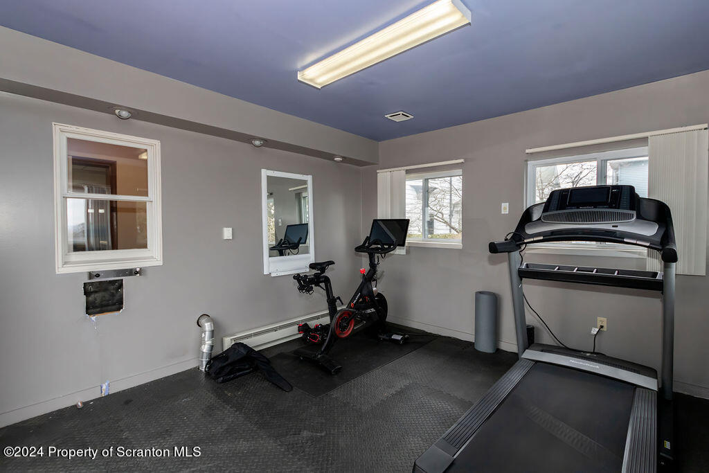 1148 West Locust Street Scranton, PA 18504 - Photo 23 of 40 a room with gym equipment and a large window