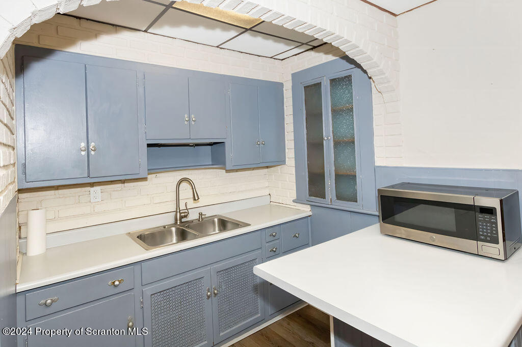 1148 West Locust Street Scranton, PA 18504 - Photo 3 of 40 a kitchen with a sink a microwave and cabinets