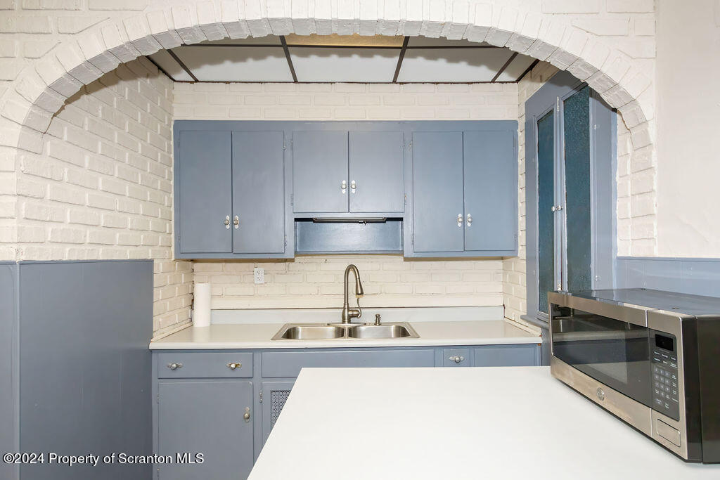 1148 West Locust Street Scranton, PA 18504 - Photo 5 of 40 a kitchen with a sink and cabinets