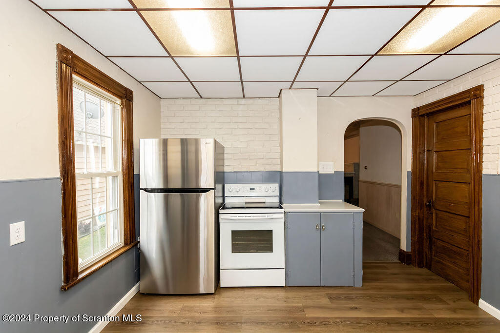 1148 West Locust Street Scranton, PA 18504 - Photo 7 of 40 a kitchen with stainless steel appliances a refrigerator sink and cabinets