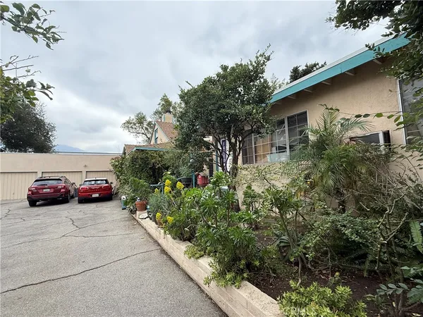 a view of a car park in front of a house
