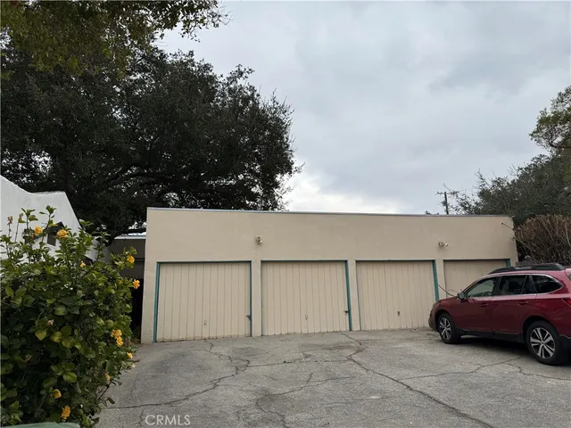 a view of parking space and yard