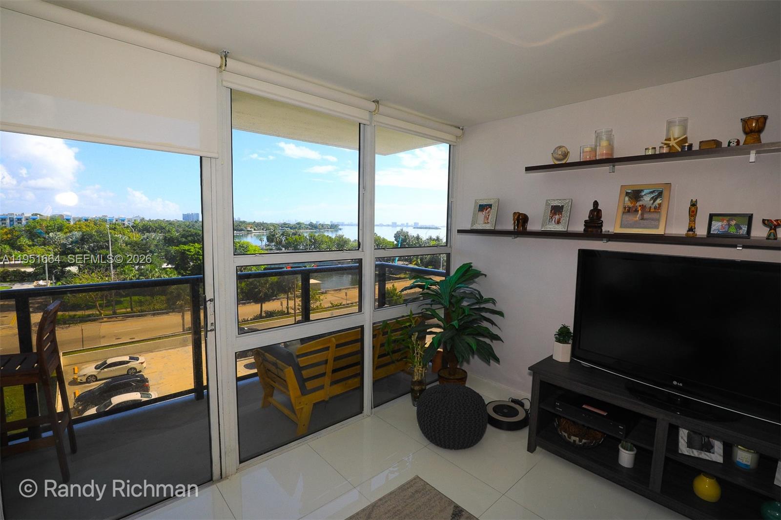 600 Northeast 36th Street, Unit 514 Miami, FL 33137 - Photo 14 of 27 a living room with furniture and a flat screen tv