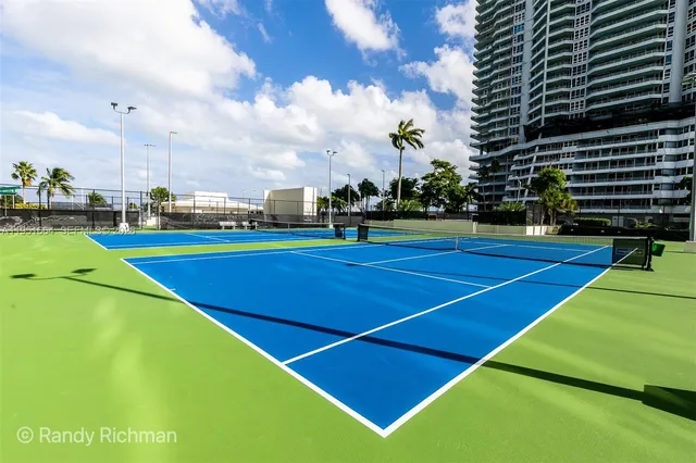 a view of an outdoor space and tennis court