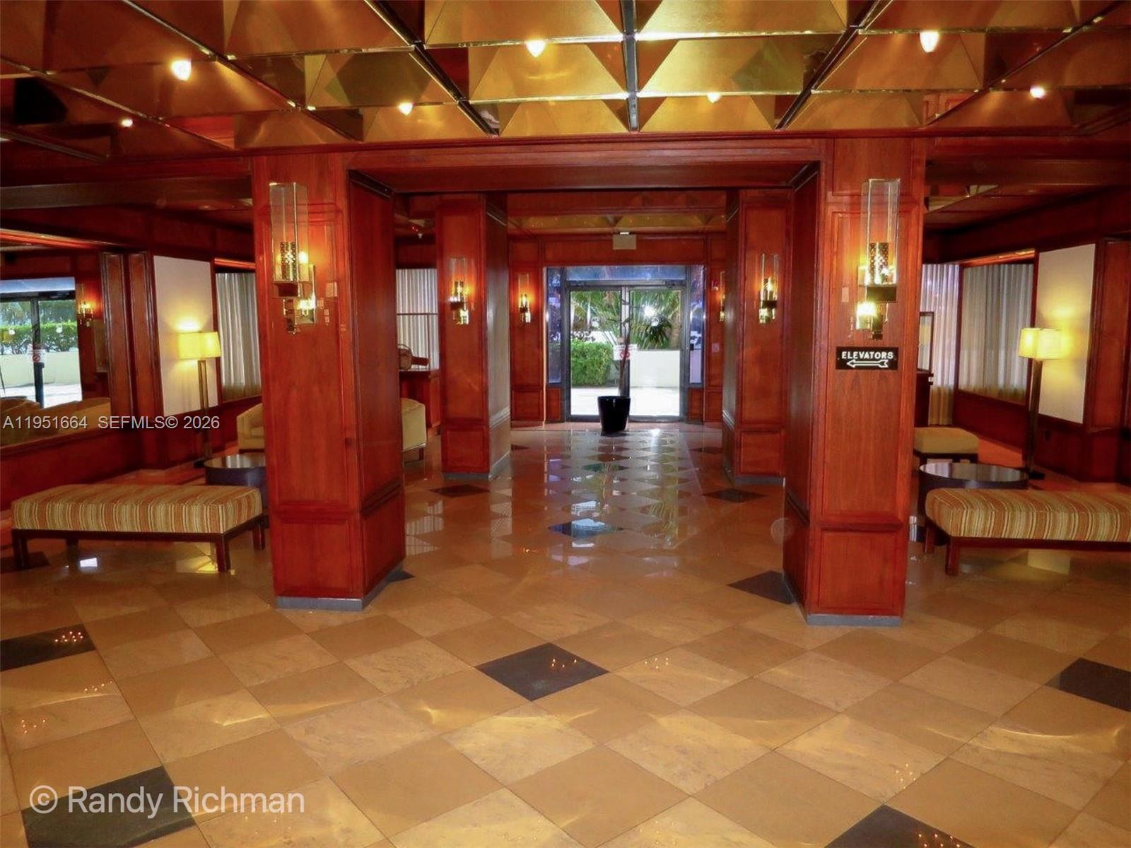 600 Northeast 36th Street, Unit 514 Miami, FL 33137 - Photo 23 of 27 a view of a lobby with a table and chair