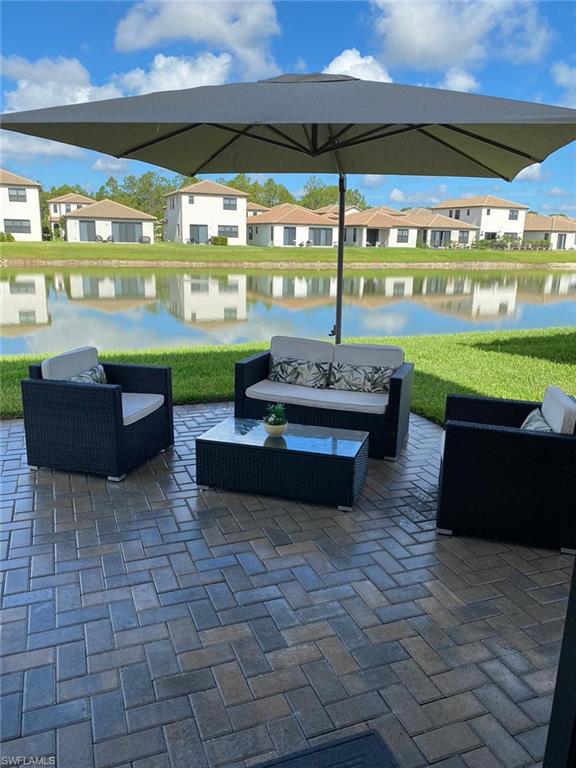 8984 Madrid Circle Naples, FL 34104 - Photo 15 of 15 a room with pool table and chairs