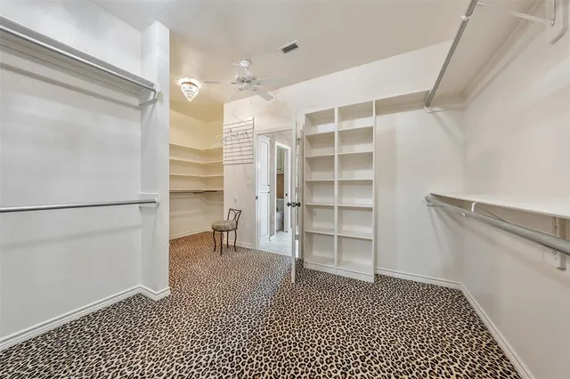 a kitchen with a sink a stove and cabinets