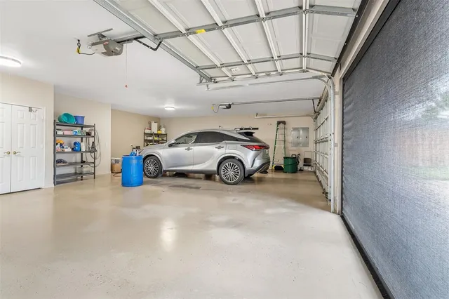 a view of a livingroom with walk in closet and a window
