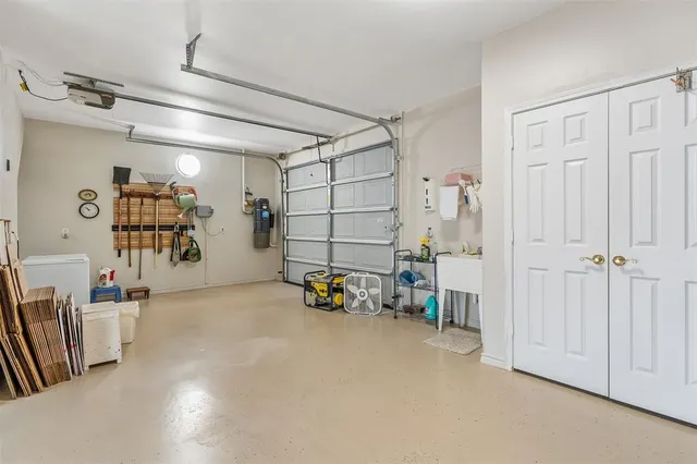 a front view of a house with a garden and yard