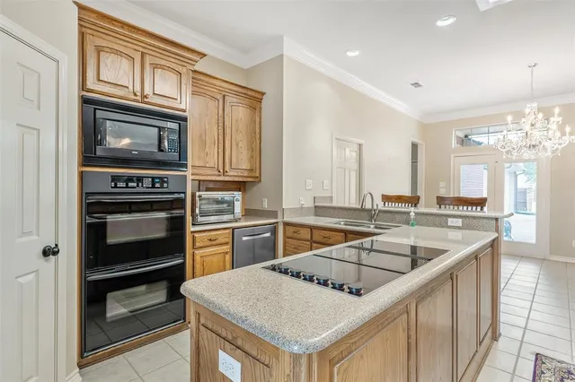 a kitchen with a stove sink and microwave