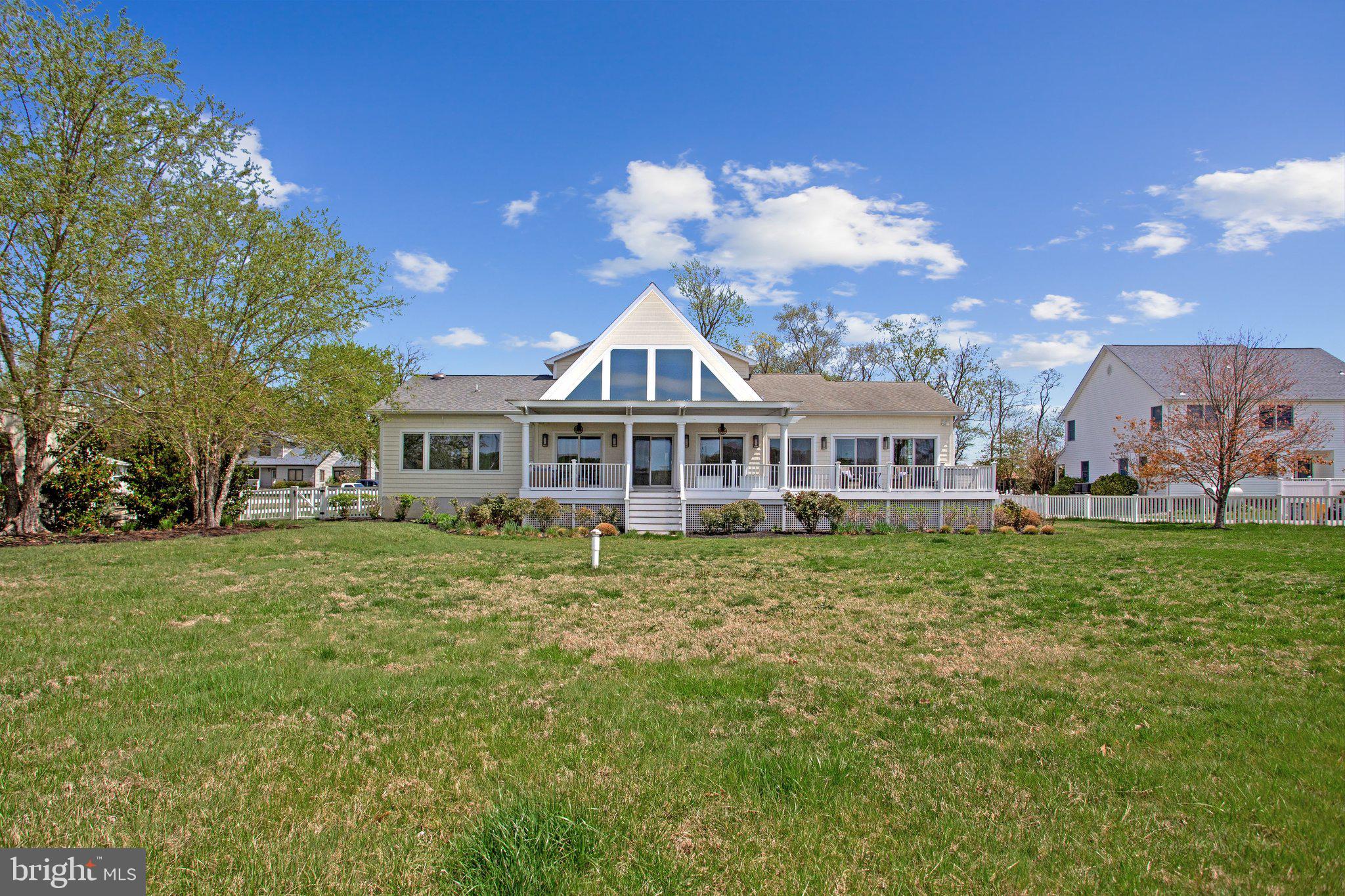 6146 Drum Point Road Deale, MD 20751 - Photo 56 of 75 a front view of a house with a garden