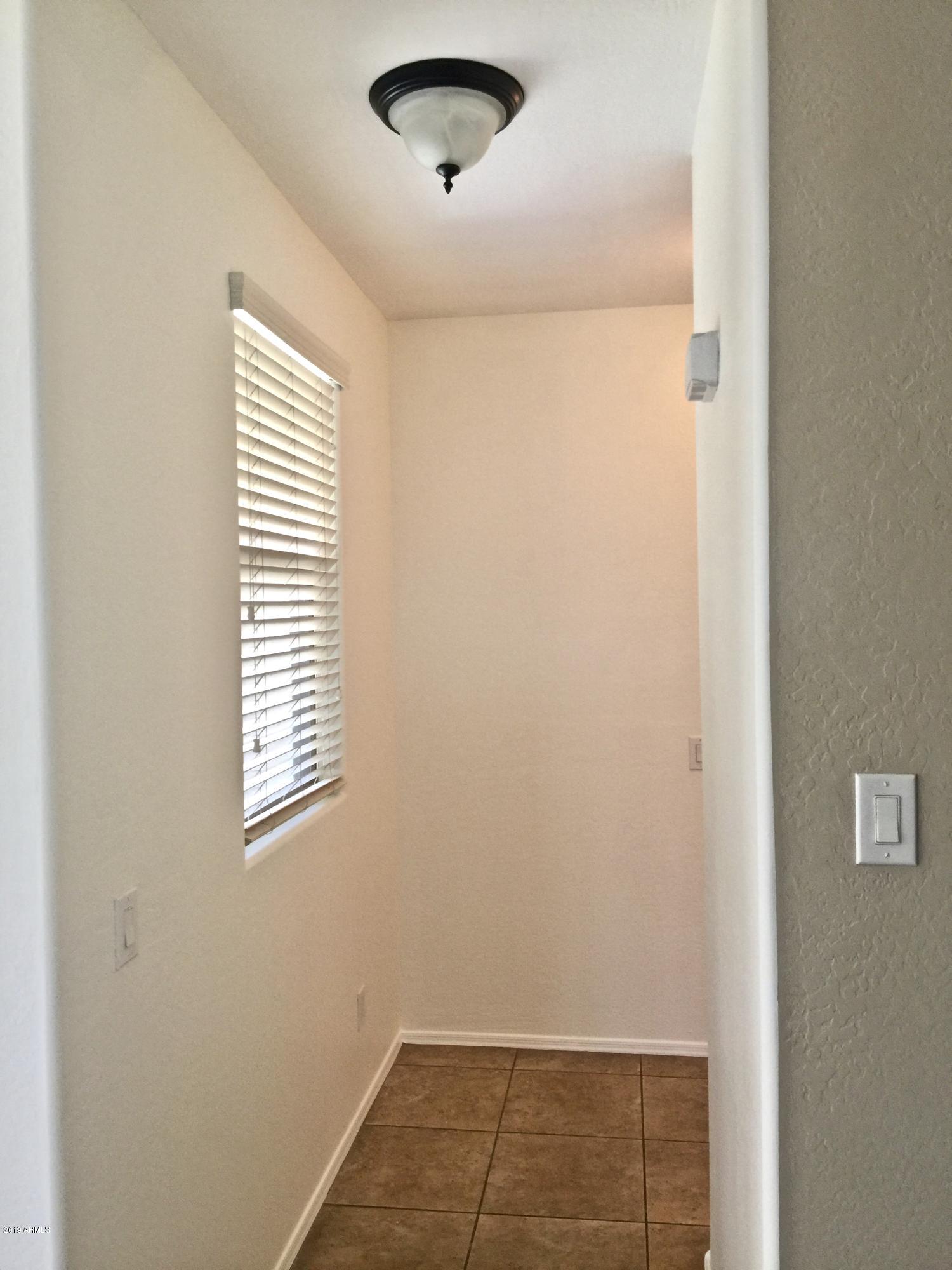 2891 South Anderson Lane Gilbert, AZ 85295 - Photo 10 of 26 Hallway to Garage