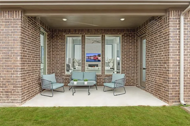 a building outdoor space with patio furniture and potted plants