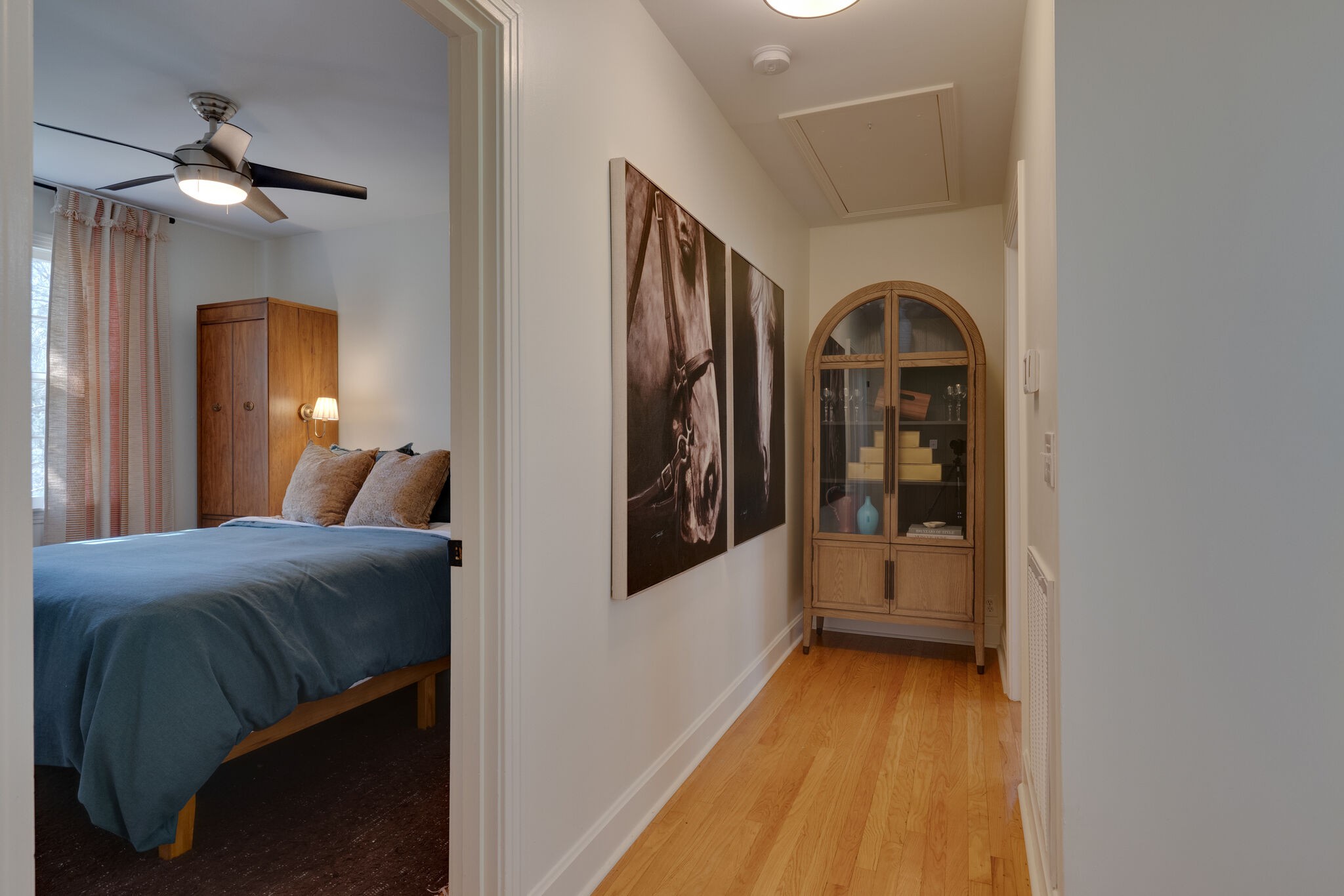 4529 Shys Hill Road Nashville, TN 37215 - Photo 28 of 51 a bedroom with a bed and a chandelier