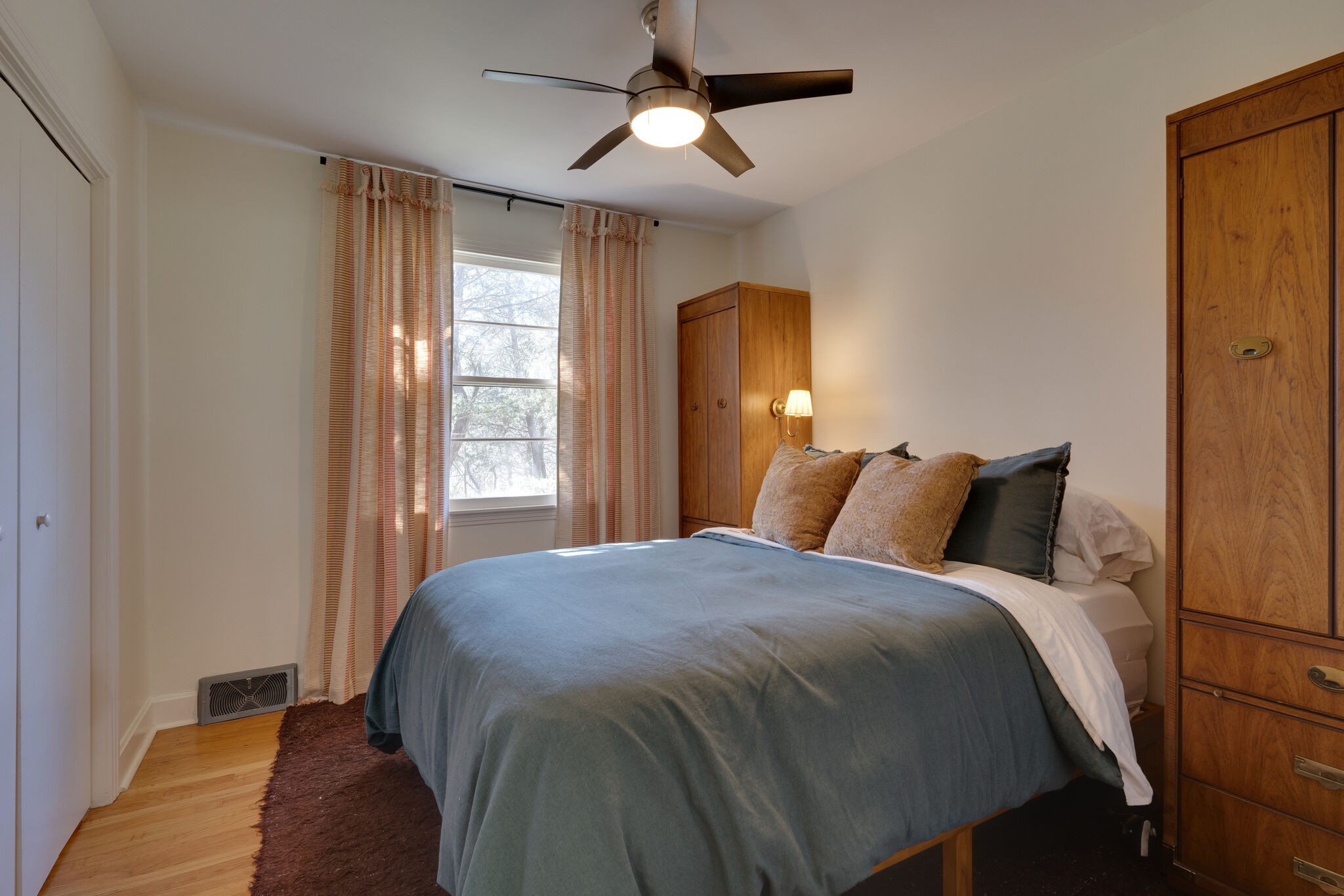 4529 Shys Hill Road Nashville, TN 37215 - Photo 29 of 51 a bed sitting in a bedroom next to a window and a chandelier