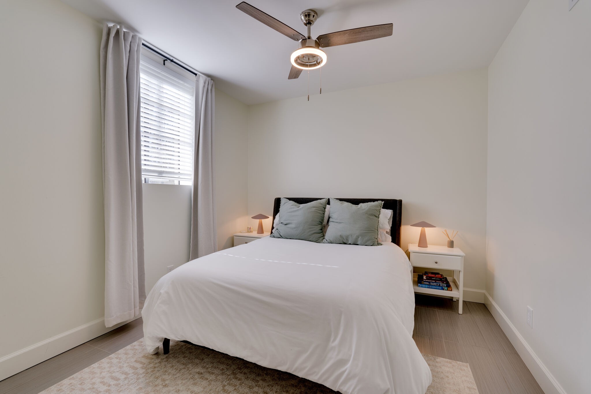 4529 Shys Hill Road Nashville, TN 37215 - Photo 36 of 51 a bedroom with a bed and a window