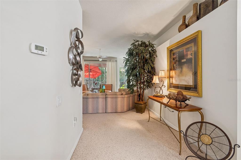 894 Lantern Way Clearwater, FL 33765 - Photo 11 of 75 a living room with furniture and a flat screen tv