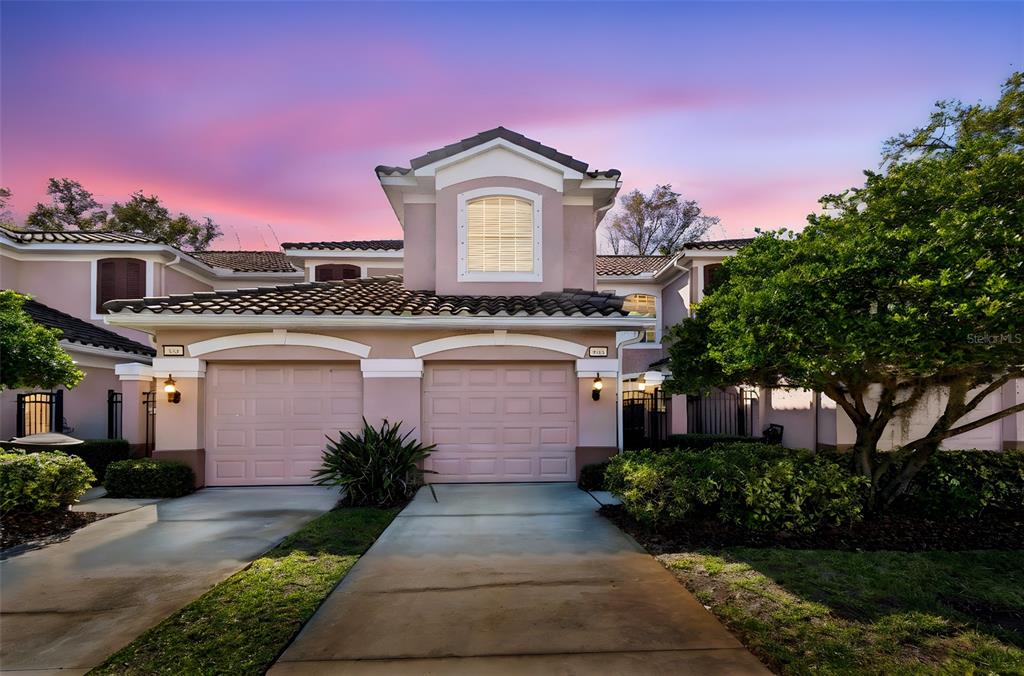 894 Lantern Way Clearwater, FL 33765 - Photo 2 of 75 a front view of a house with a garden